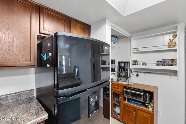 a kitchen with a sink and a refrigerator