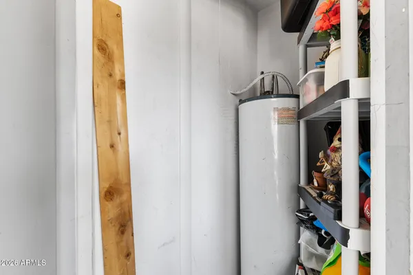 a bathroom with a sink vanity mirror and toilet