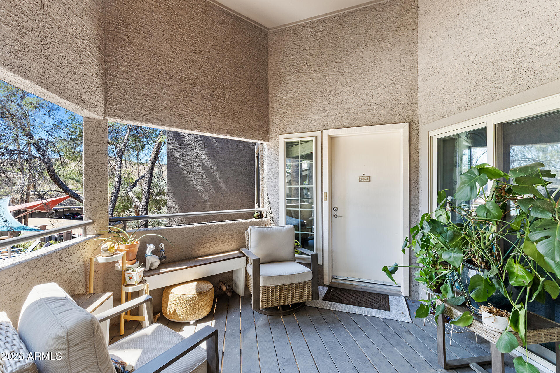 1720 East Thunderbird Road, Unit 2063 Phoenix, AZ 85022 - Photo 5 of 32 a living room with furniture and a potted plant