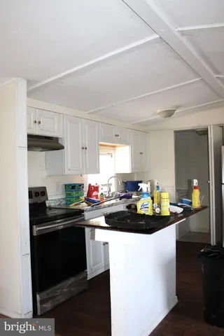 a kitchen with sink and cabinets