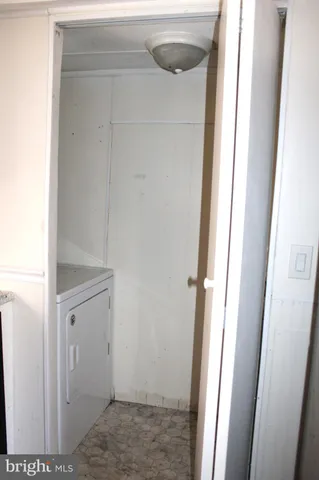 a view of storage and utility room with a sink