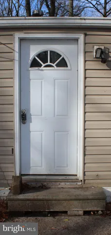 a view of a wooden door of a house