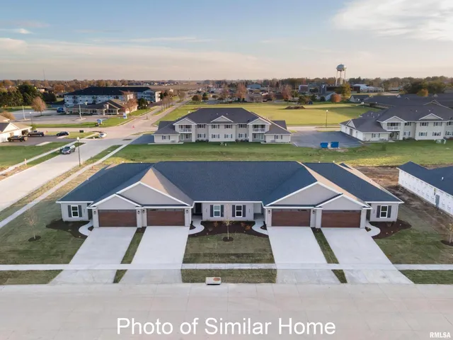 an aerial view of a house with a ocean view
