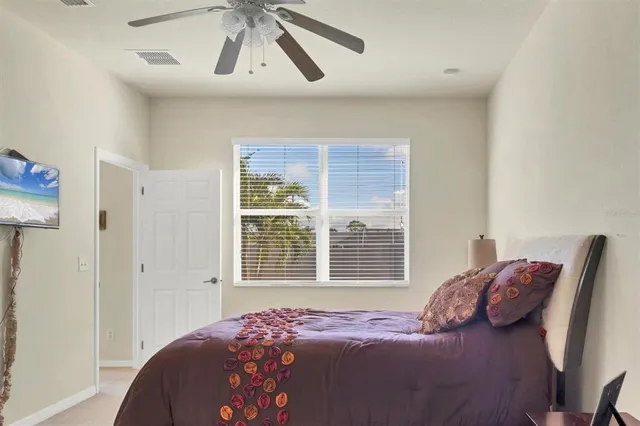 a bedroom with a bed and a window