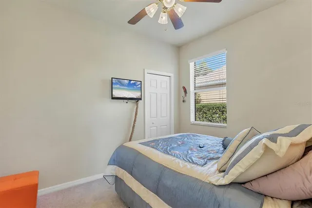 a bedroom with a bed and a couch