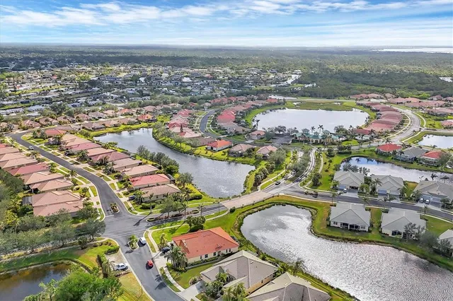 an aerial view of residential houses with outdoor space