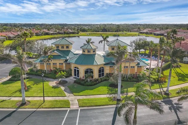 an aerial view of residential houses with outdoor space and river view