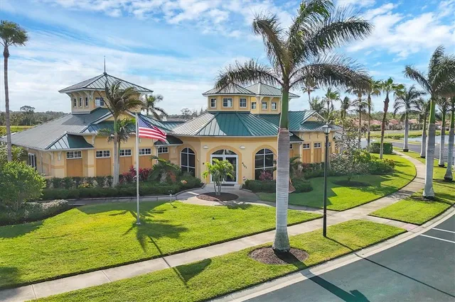 a view of an house with backyard and palm tree