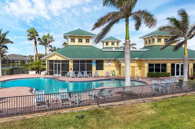 a front view of house with yard and outdoor seating