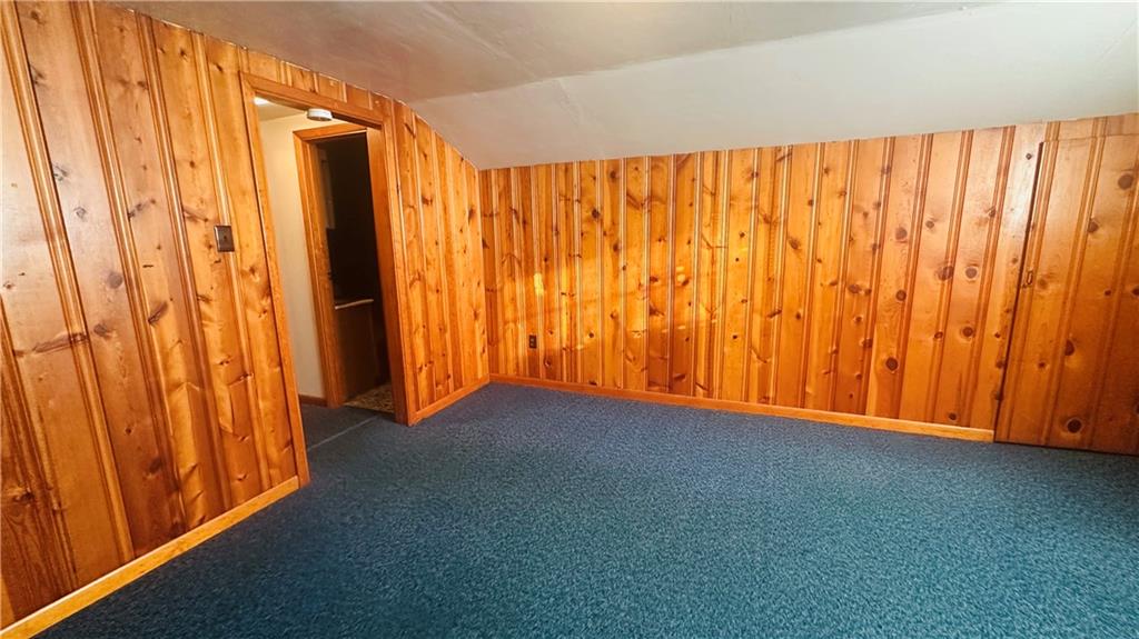 708 Lardintown Road Tarentum, PA 15084 - Photo 39 of 47 Bedroom upper level. The open closet area is a closet and access to storage in the eaves. Also, built in drawers. 13.1x12 with open staircase. Knotty Pine panelling.