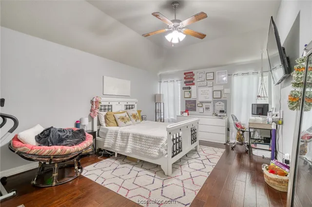a bedroom with furniture and a chandelier