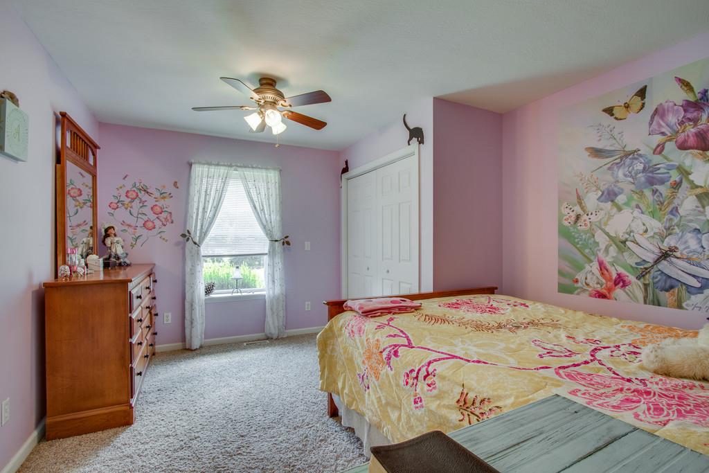 596 Goad Ridge Lane Pleasant Shade, TN 37145 - Photo 17 of 30 a bedroom with a bed and a window