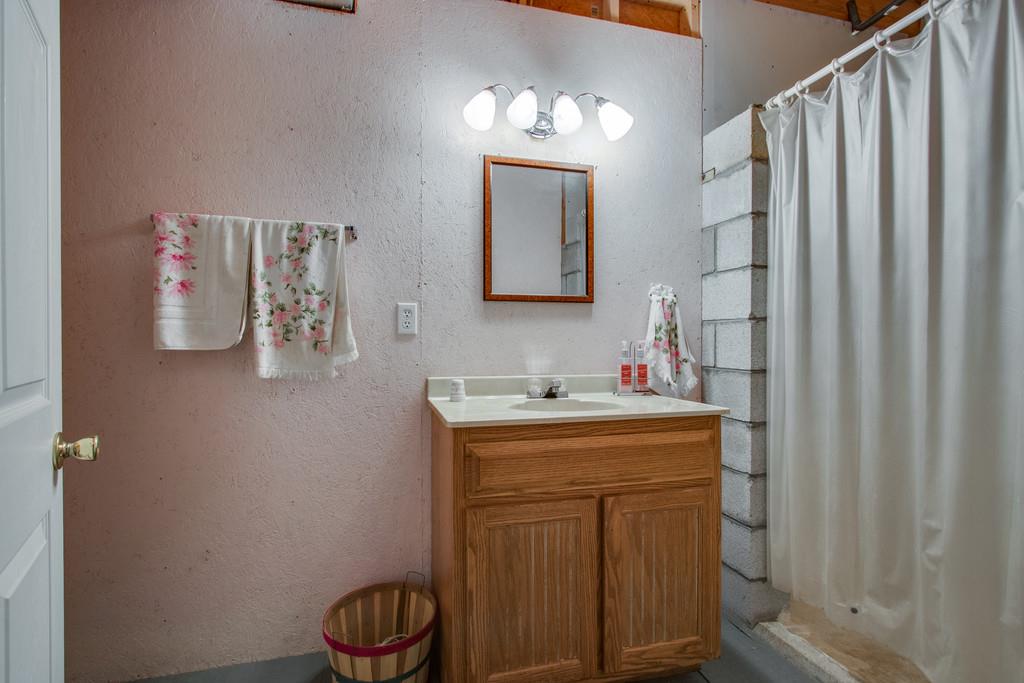 596 Goad Ridge Lane Pleasant Shade, TN 37145 - Photo 23 of 30 a bathroom with a sink vanity and mirror