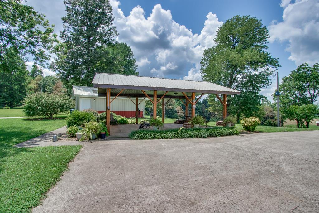 596 Goad Ridge Lane Pleasant Shade, TN 37145 - Photo 26 of 30 a front view of a house with a yard