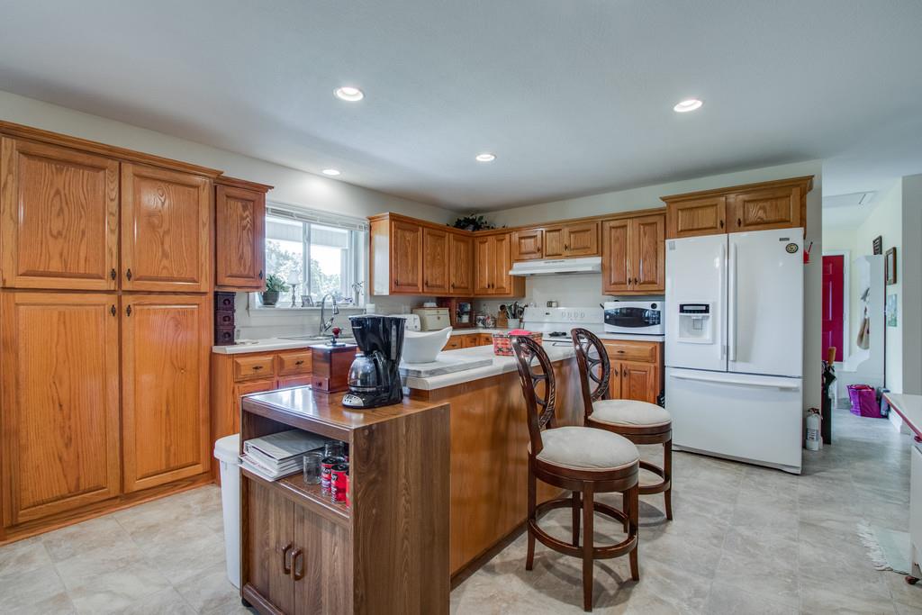 596 Goad Ridge Lane Pleasant Shade, TN 37145 - Photo 6 of 30 a view of kitchen with furniture a refrigerator and wooden floor