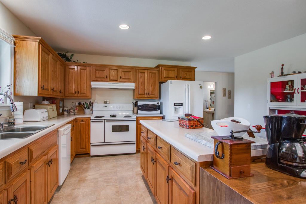 596 Goad Ridge Lane Pleasant Shade, TN 37145 - Photo 7 of 30 a kitchen with stainless steel appliances a sink and a refrigerator