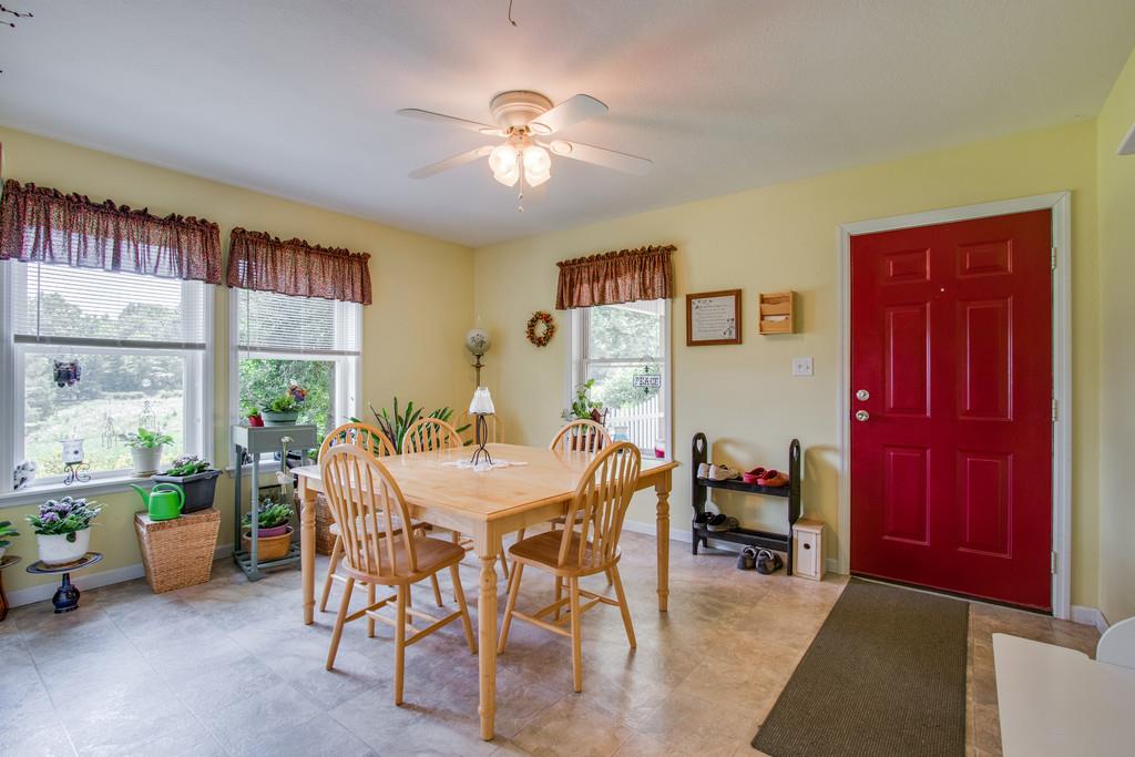 596 Goad Ridge Lane Pleasant Shade, TN 37145 - Photo 10 of 30 a view of a dining room with furniture window and outside view