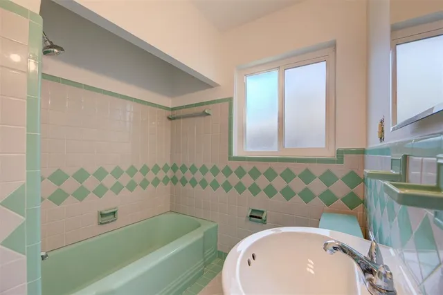 a bathroom with a sink a toilet and a bathtub