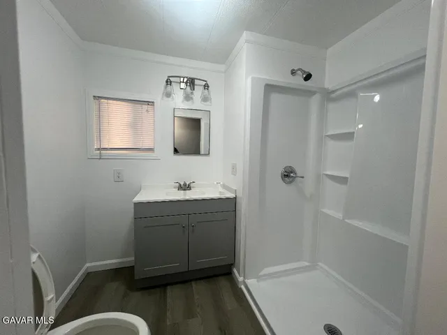 a bathroom with a sink and shower