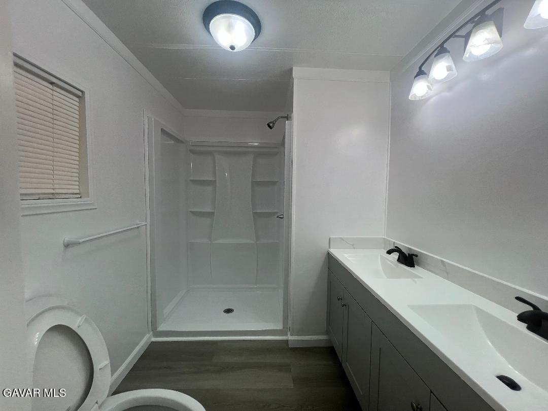 3300 15th Street West, Unit SPC 57 Rosamond, CA 93560 - Photo 12 of 23 a bathroom with a sink and shower