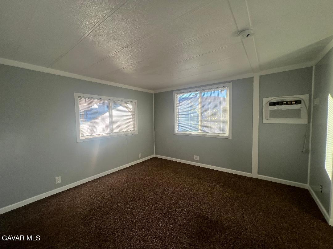 3300 15th Street West, Unit SPC 57 Rosamond, CA 93560 - Photo 14 of 23 an empty room with windows