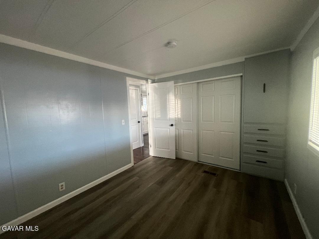 3300 15th Street West, Unit SPC 57 Rosamond, CA 93560 - Photo 15 of 23 wooden floor in an empty room
