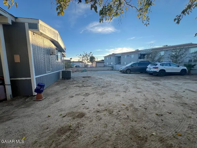 a view of a car park in front of house