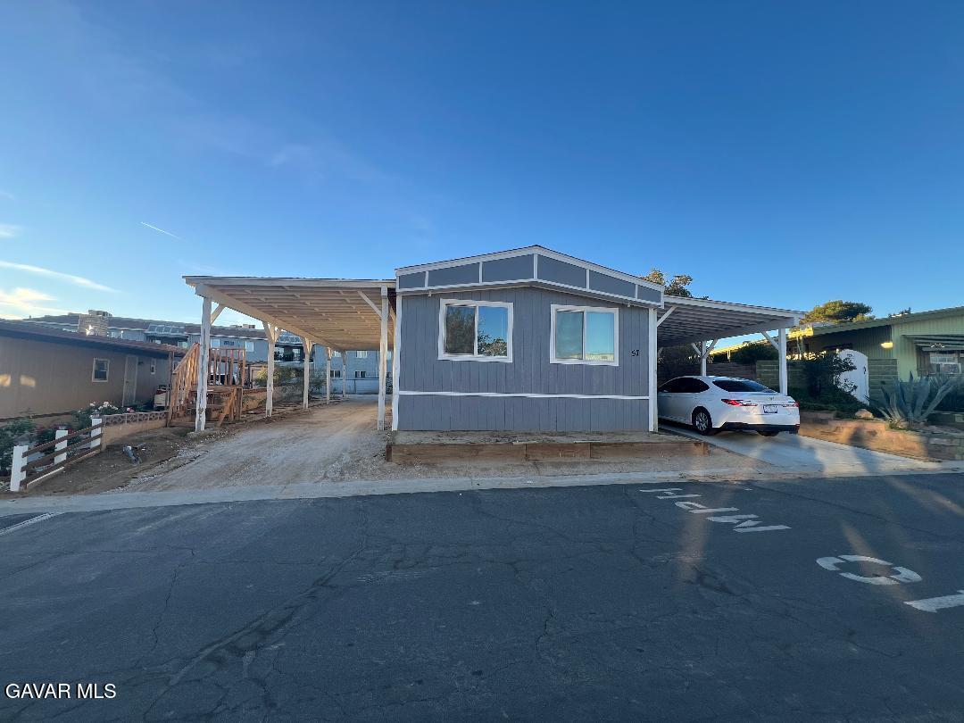 3300 15th Street West, Unit SPC 57 Rosamond, CA 93560 - Photo 2 of 23 a car parked on the side of the road