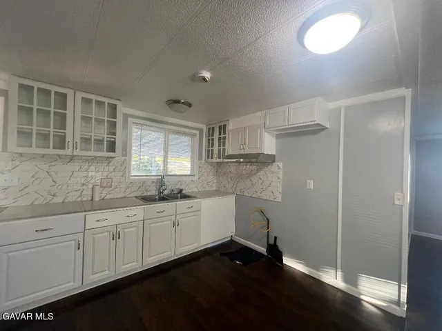 a kitchen with sink and window