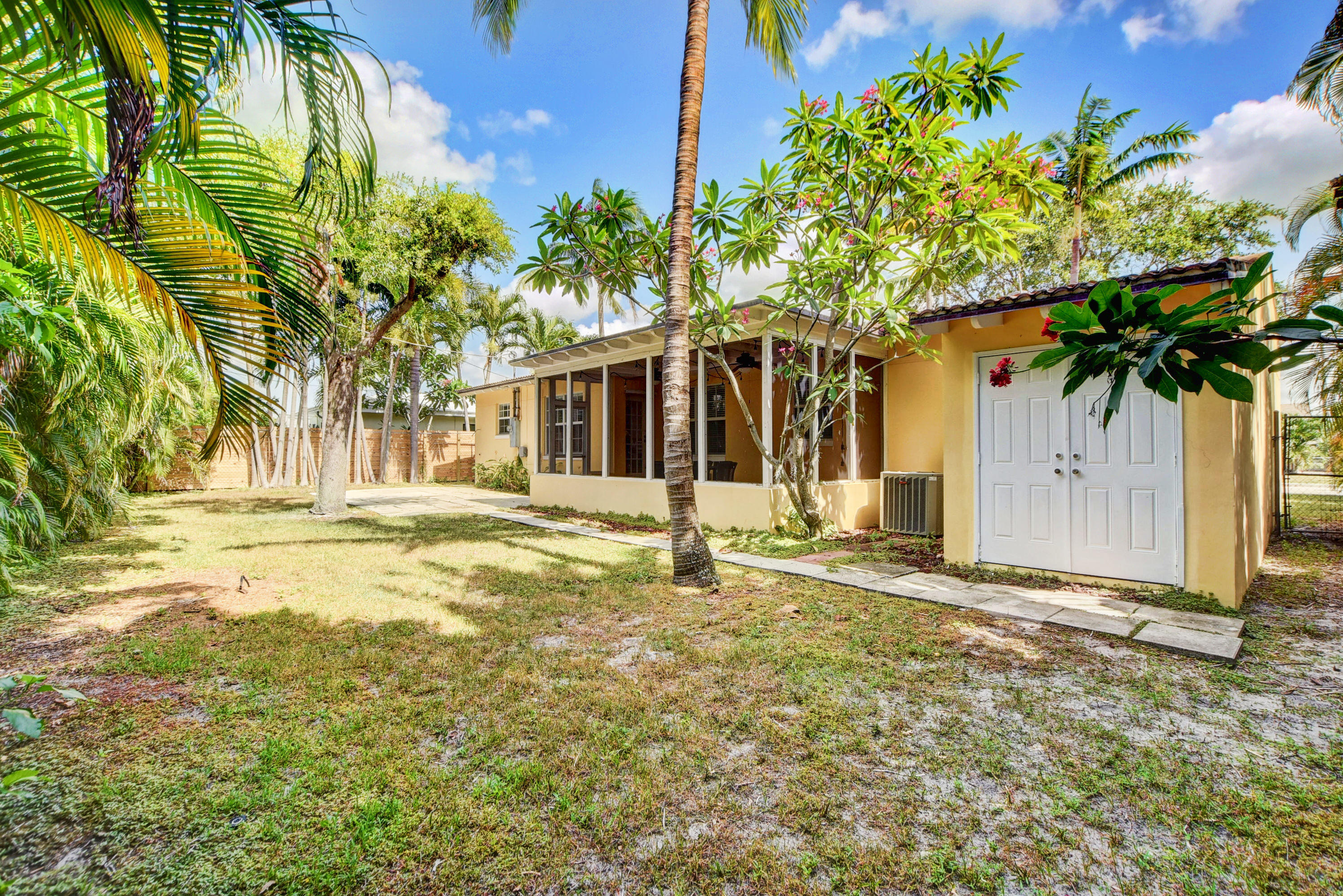324 Edmor Road West Palm Beach, FL 33405 - Photo 25 of 26 Backyard with Additional Storage