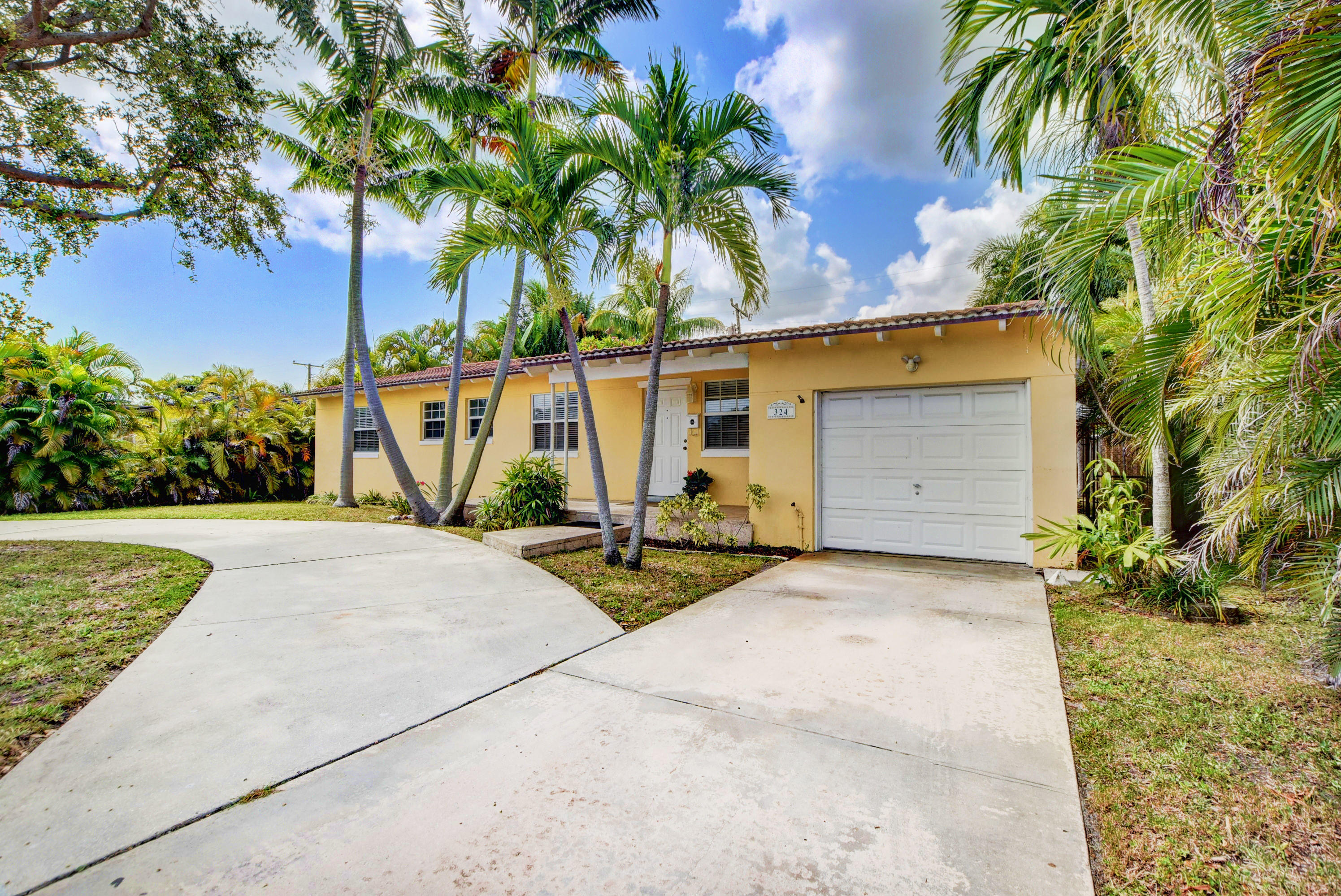 324 Edmor Road West Palm Beach, FL 33405 - Photo 3 of 26 Front Elevation with Garage