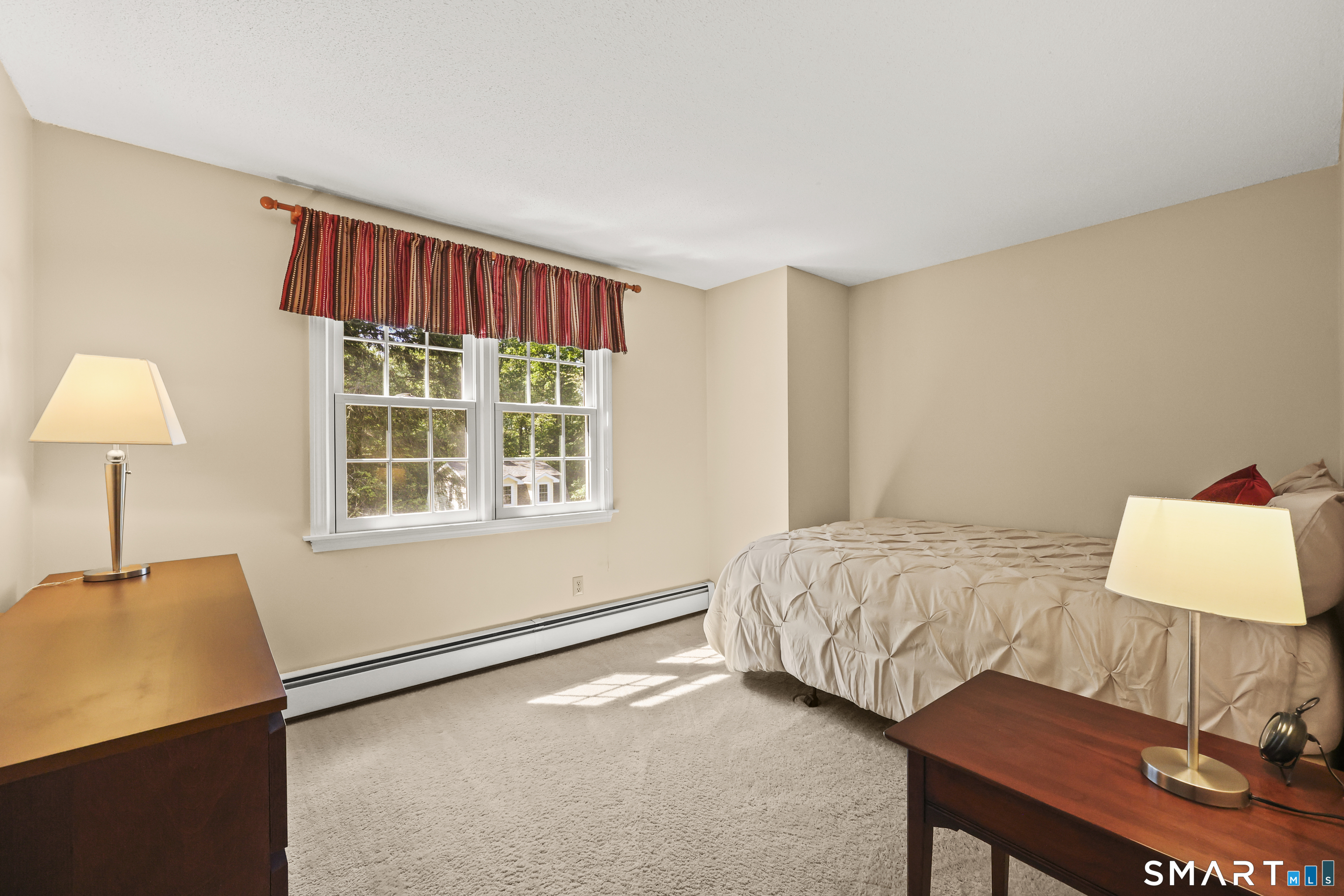 17 Briar Hill Road Avon, CT 06001 - Photo 12 of 38 The middle bedroom has views out to the back and is bright with a functional layout.