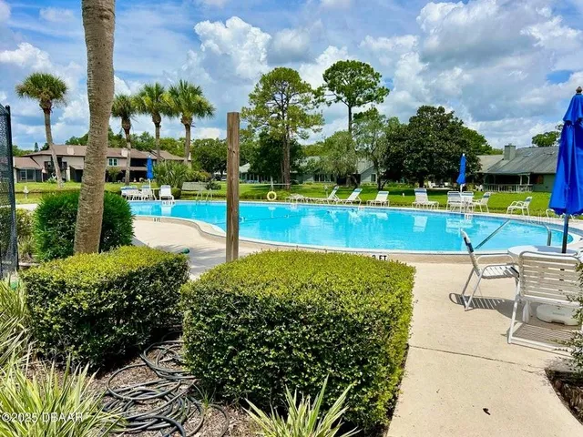 a view of a swimming pool and outdoor space
