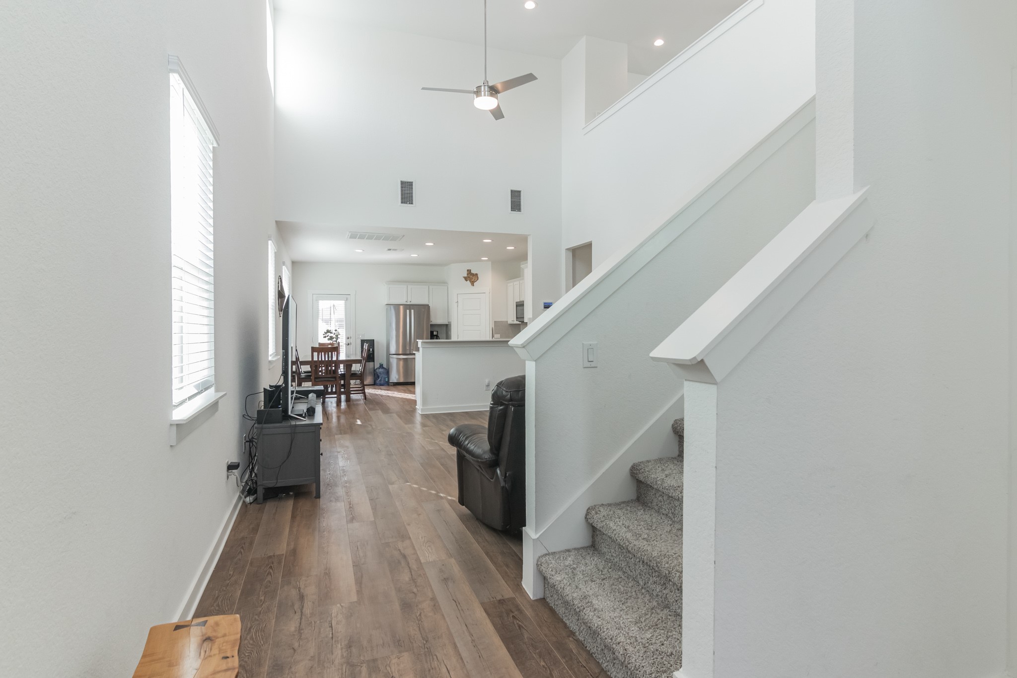 116 Century Plant Road Leander, TX 78641 - Photo 3 of 30 Hardwood floors and soaring ceilings create an open, airy flow from the entryway.