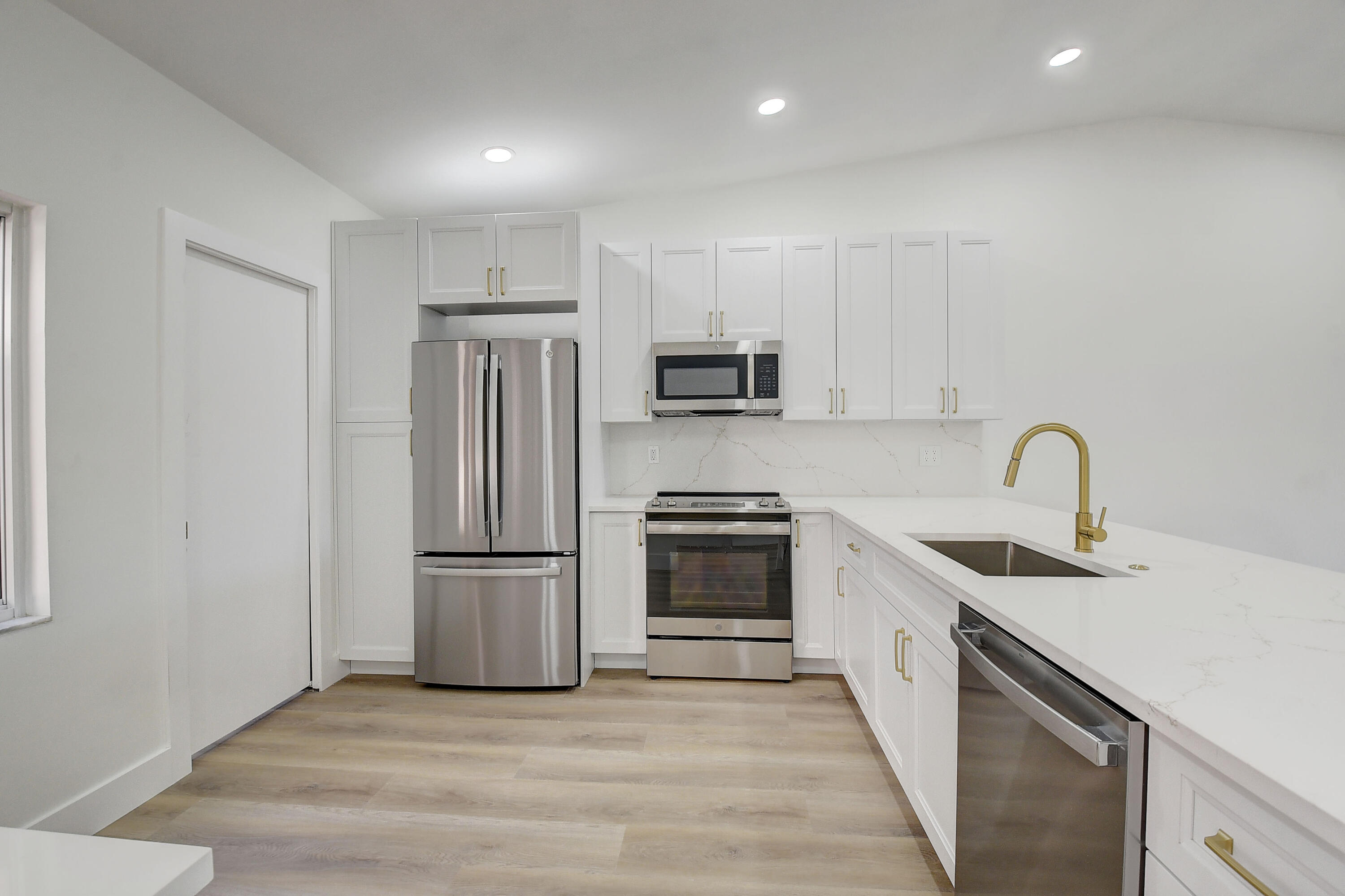8204 Summerbreeze Lane Boca Raton, FL 33496 - Photo 14 of 47 a kitchen with stainless steel appliances granite countertop a refrigerator sink and stove