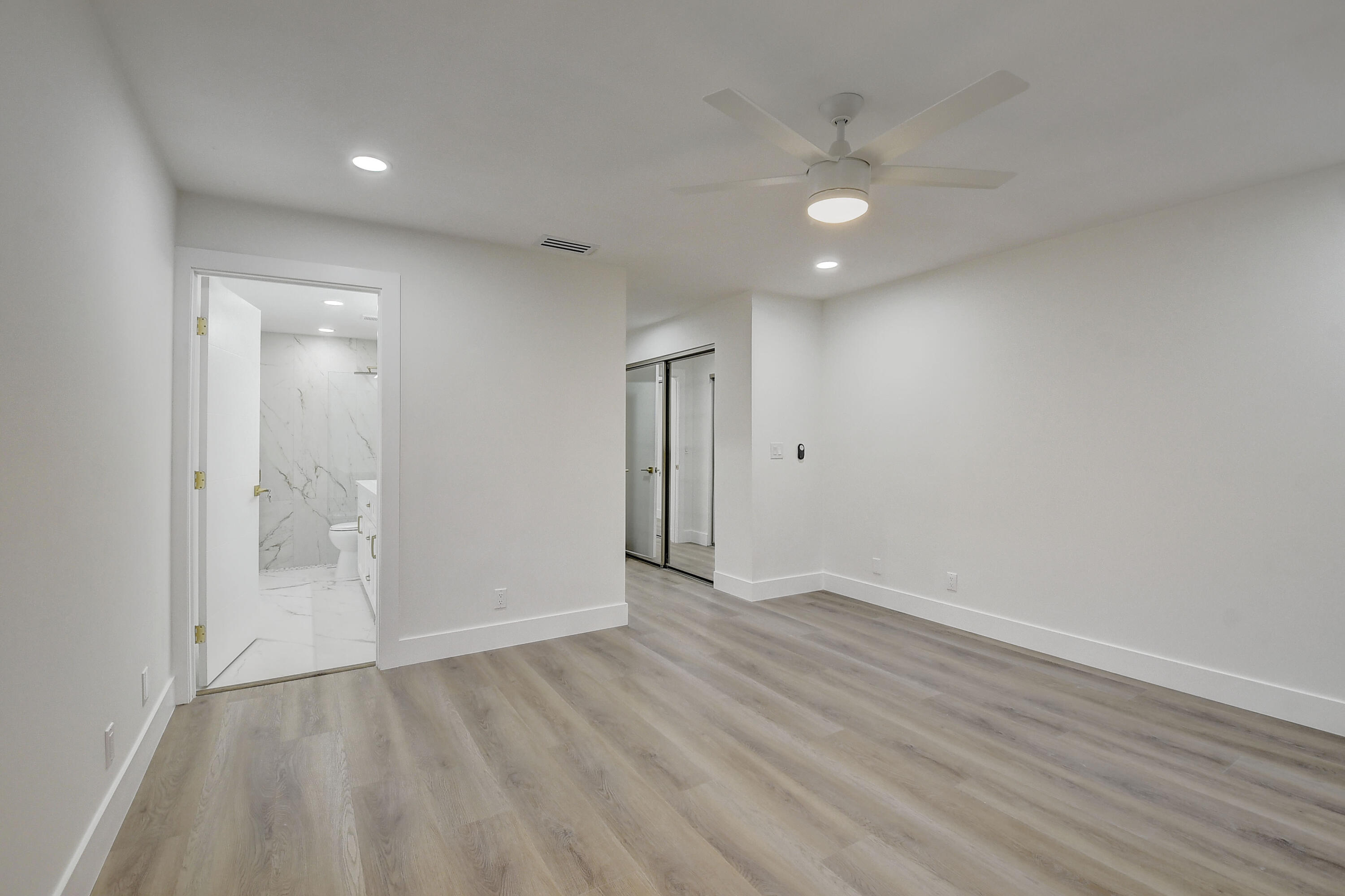8204 Summerbreeze Lane Boca Raton, FL 33496 - Photo 20 of 47 wooden floor in an empty room with a window