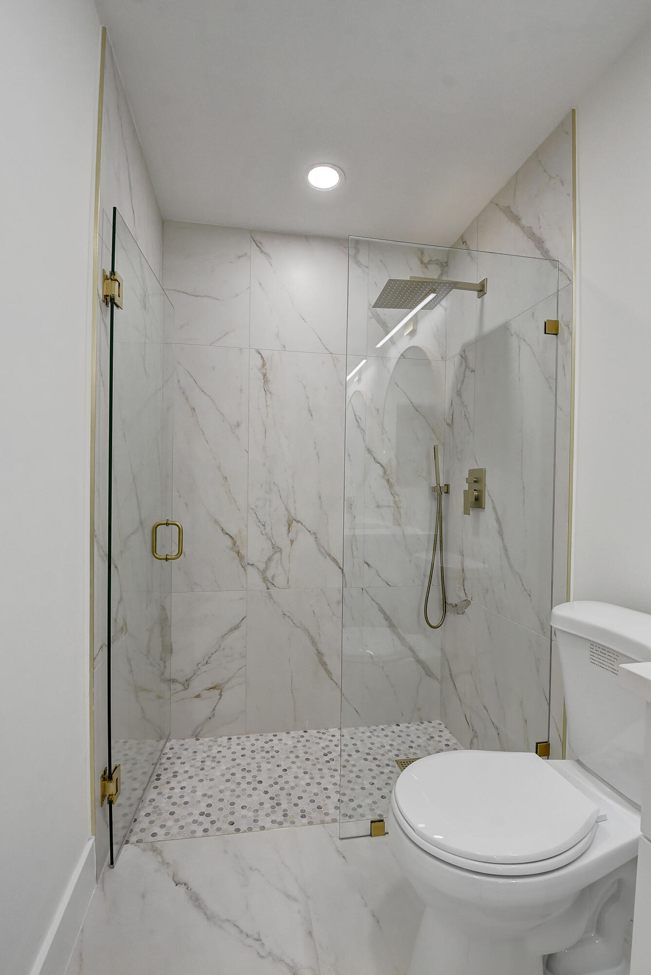8204 Summerbreeze Lane Boca Raton, FL 33496 - Photo 22 of 47 a bathroom with a toilet and a shower