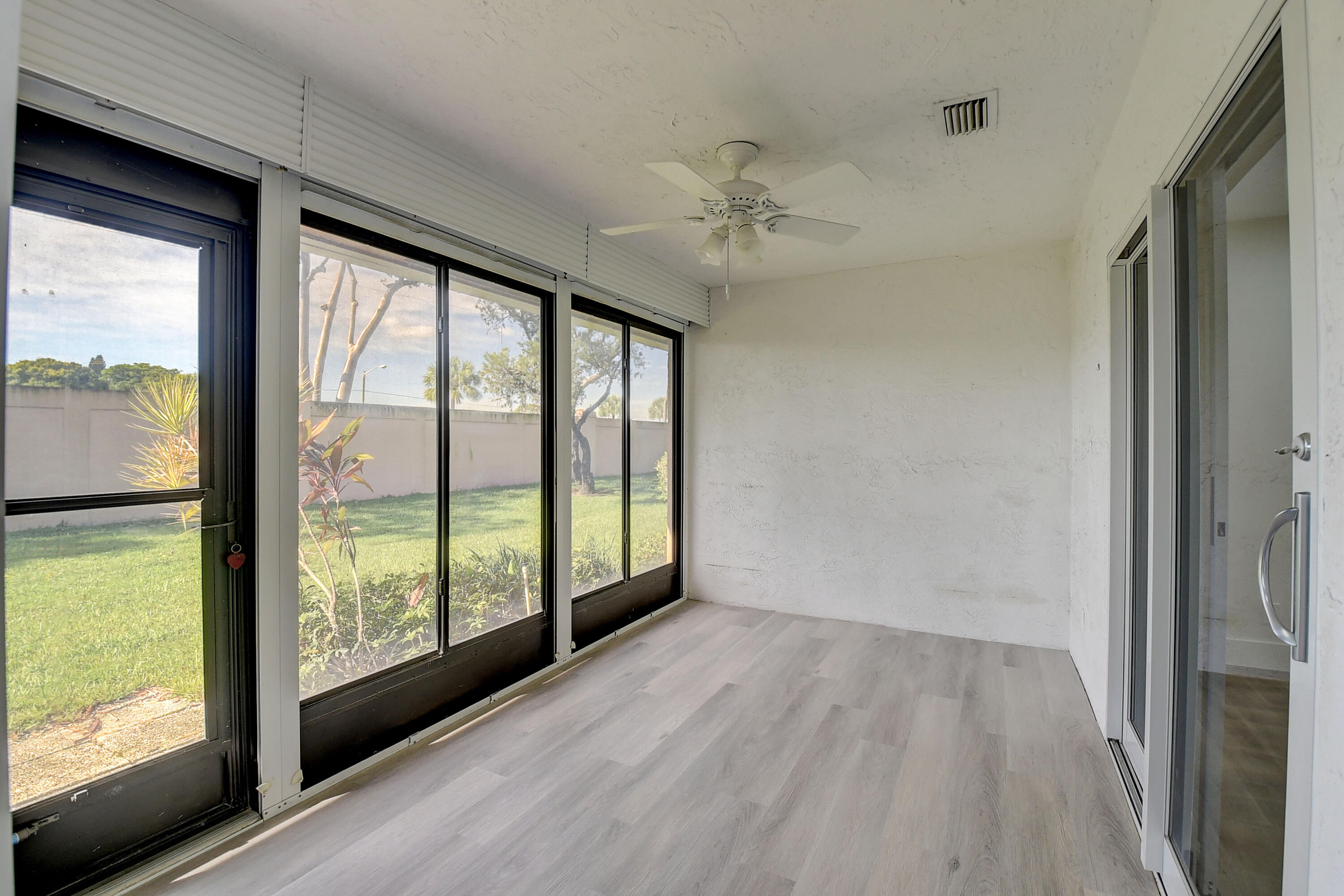 8204 Summerbreeze Lane Boca Raton, FL 33496 - Photo 26 of 47 a view of hallway with a large window