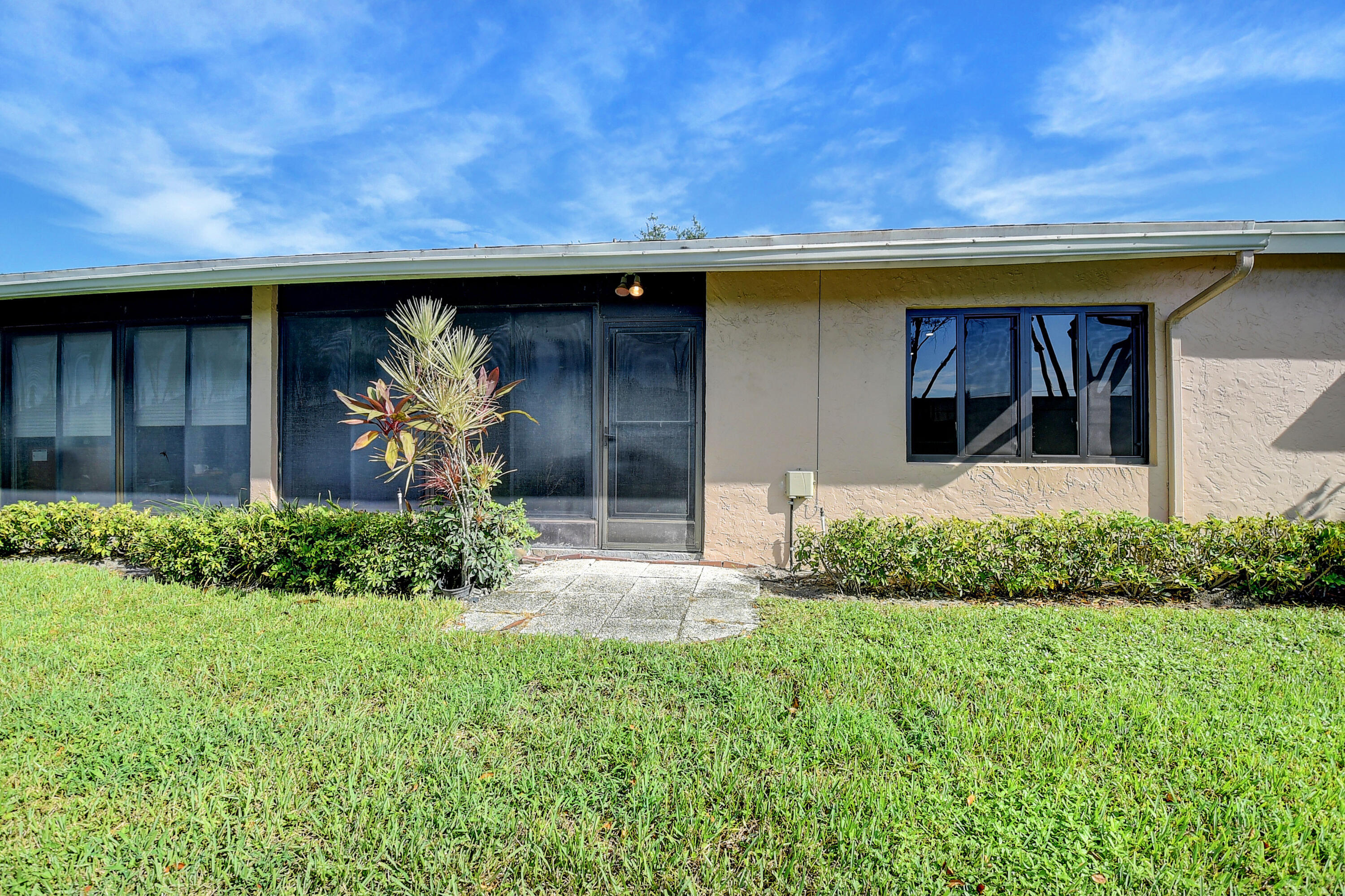 8204 Summerbreeze Lane Boca Raton, FL 33496 - Photo 30 of 47 a front view of a house with garden