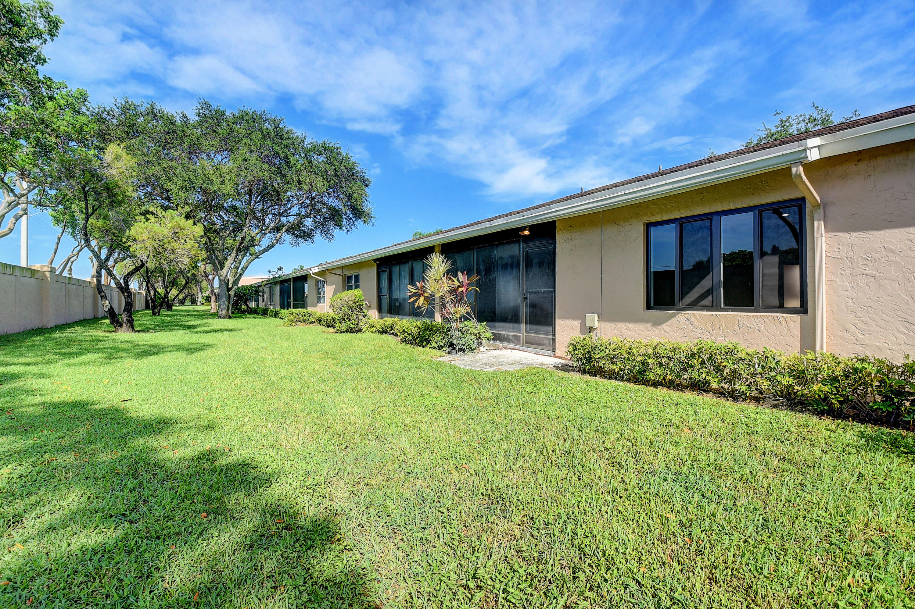 8204 Summerbreeze Lane Boca Raton, FL 33496 - Photo 31 of 47 a front view of house with yard