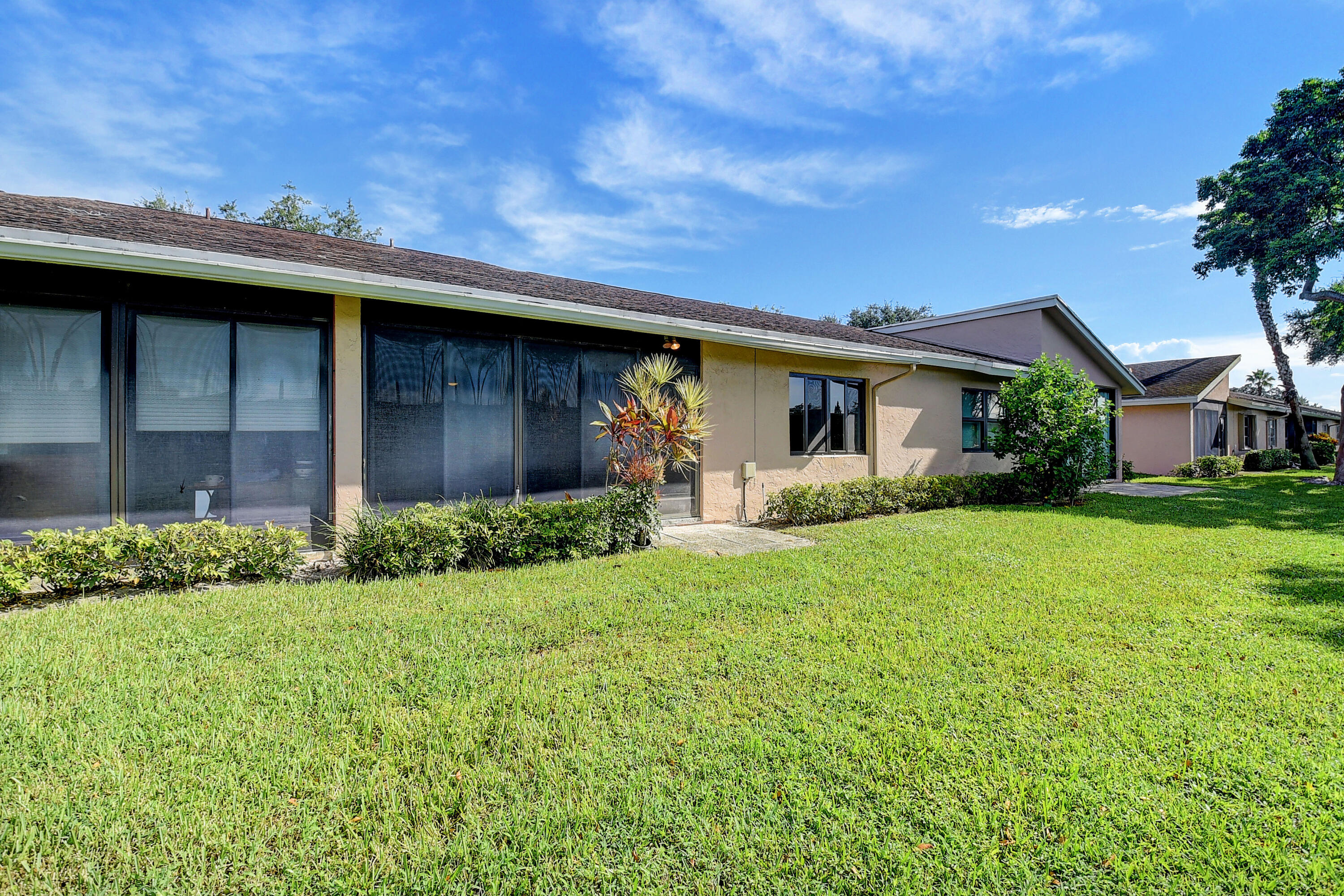8204 Summerbreeze Lane Boca Raton, FL 33496 - Photo 32 of 47 a front view of house with a garden