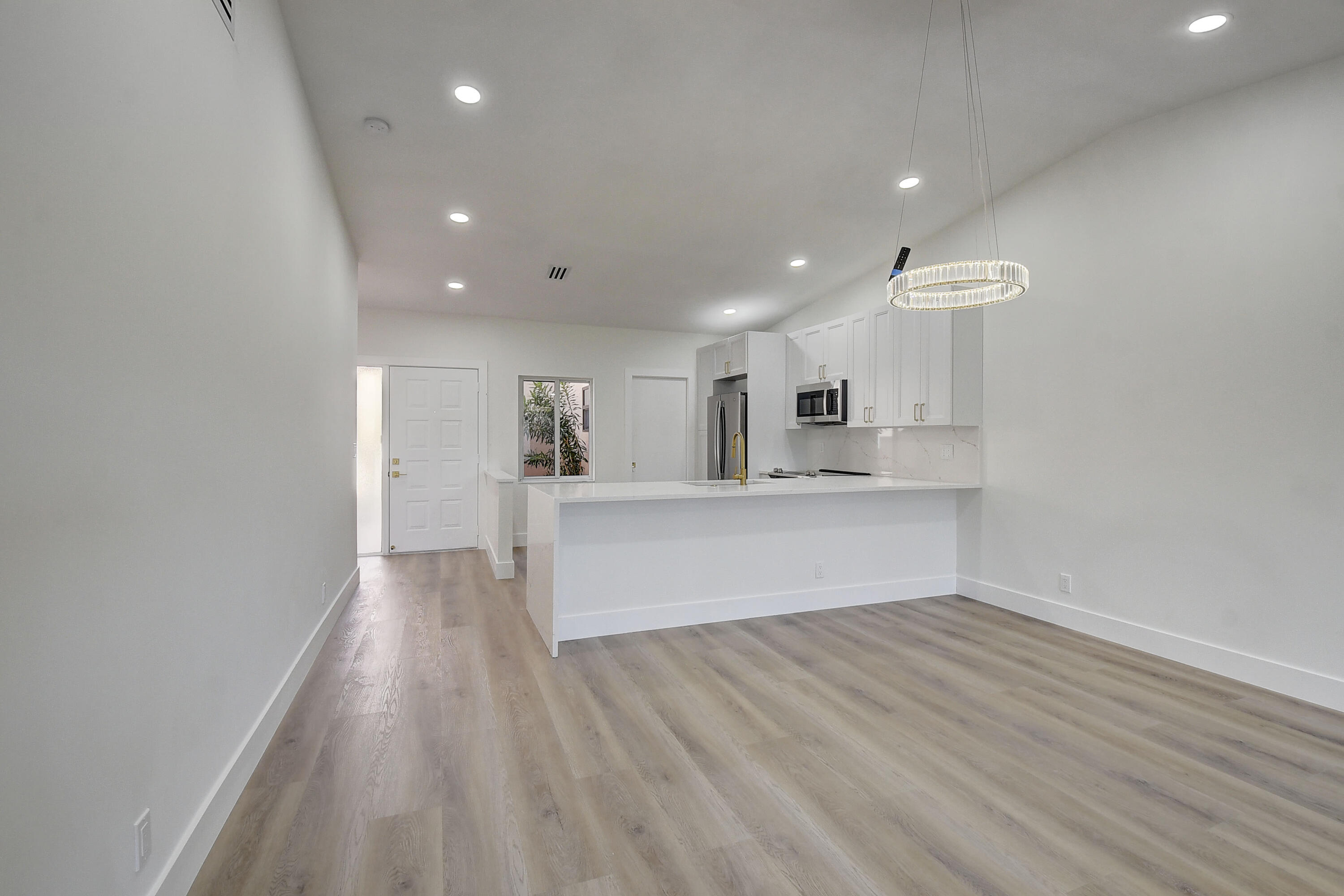 8204 Summerbreeze Lane Boca Raton, FL 33496 - Photo 5 of 47 a view of kitchen with wooden floor and window