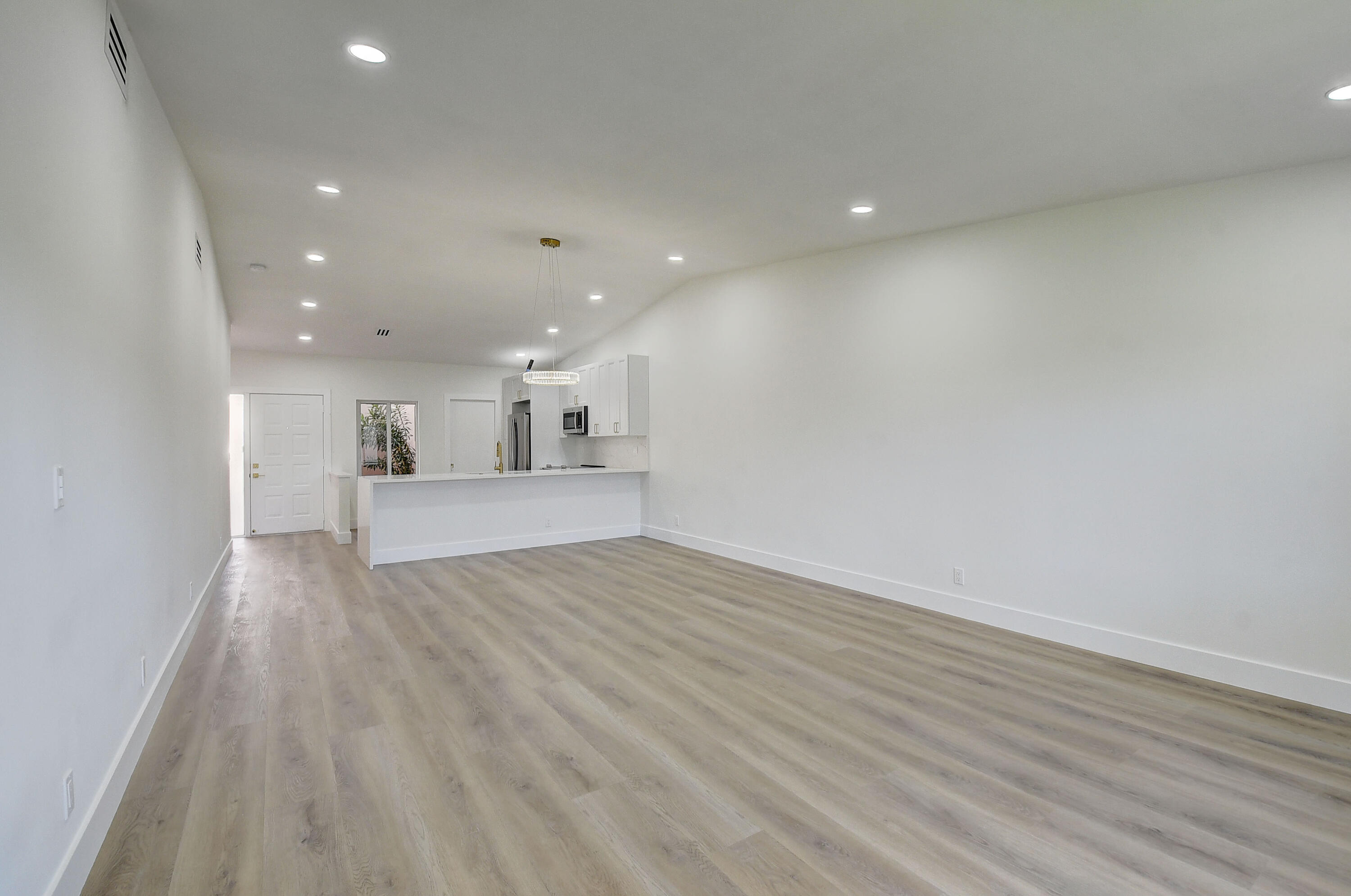 8204 Summerbreeze Lane Boca Raton, FL 33496 - Photo 10 of 47 a view of an empty room with wooden floor