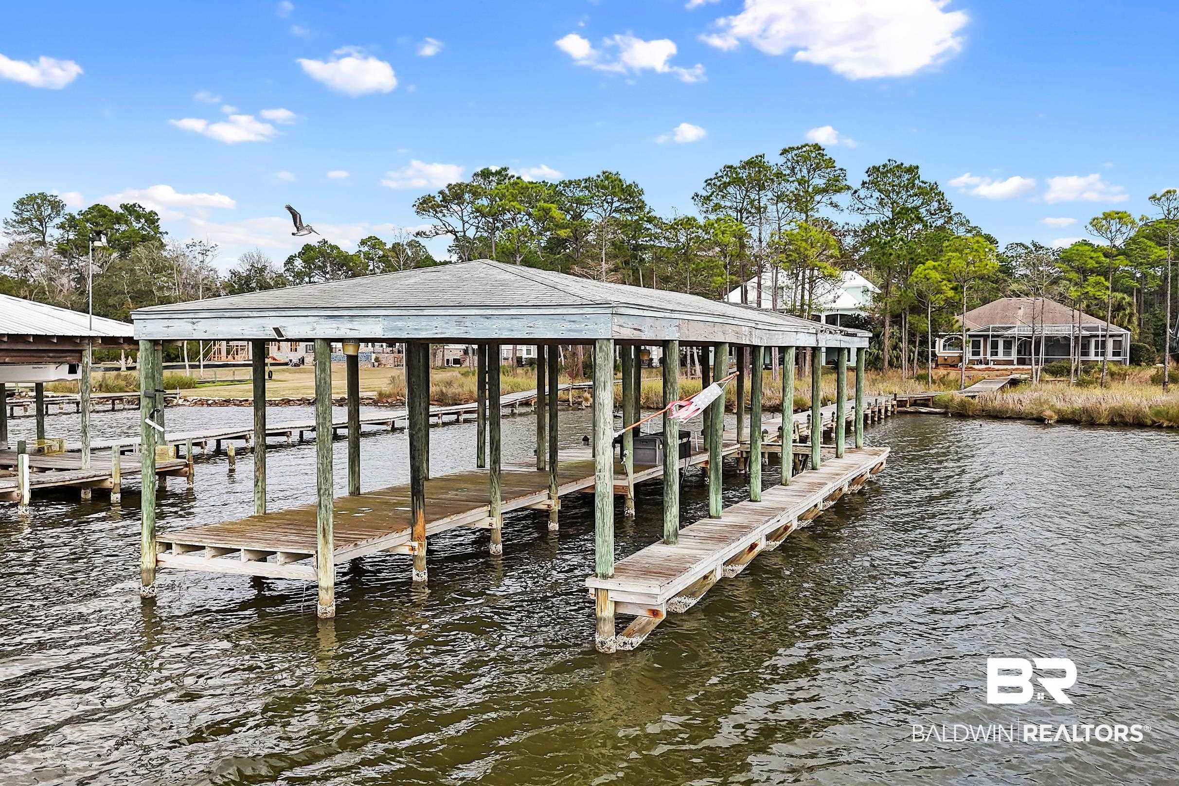 8591 Bay Harbor Road Elberta, AL 36530 - Photo 8 of 56 Dock area featuring a water view and boat lift