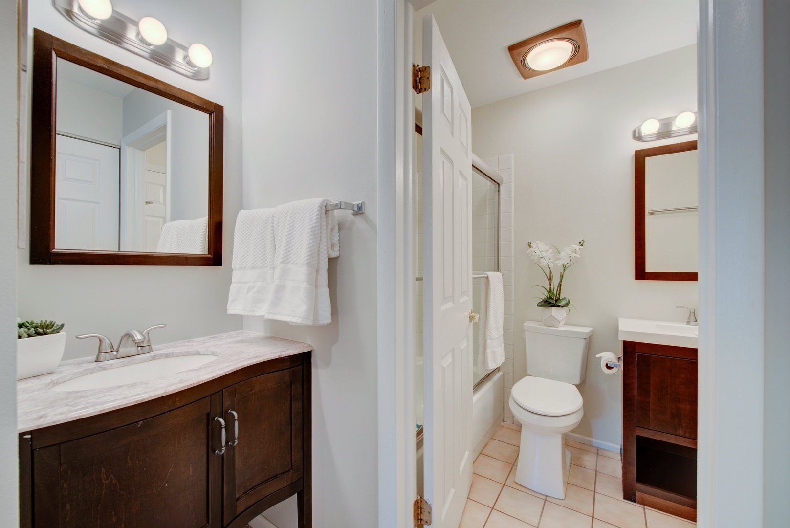 2710 Northampton Drive, Unit C2 Rolling Meadows, IL 60008 - Photo 12 of 19 a bathroom with a toilet sink a mirror and vanity