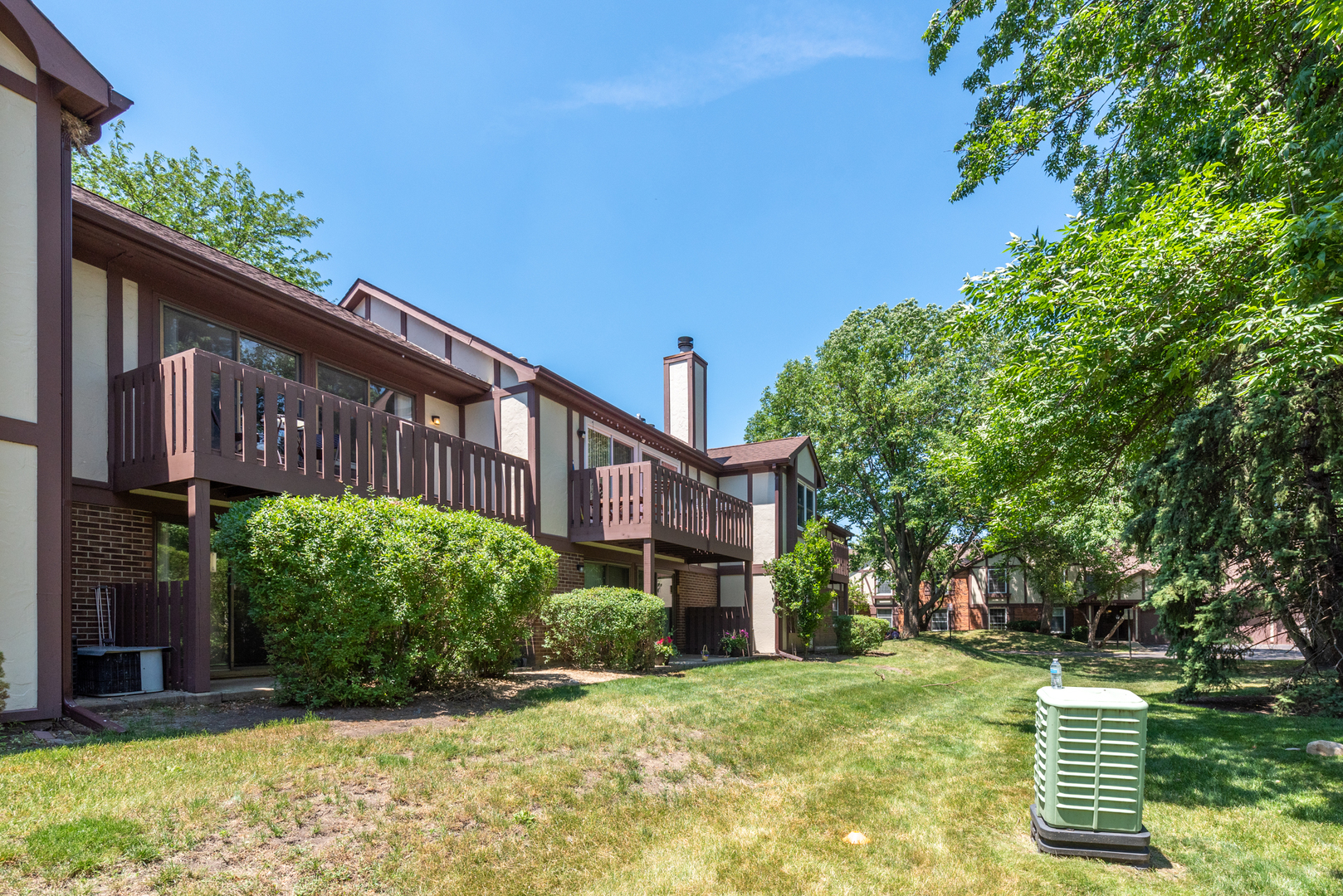 2710 Northampton Drive, Unit C2 Rolling Meadows, IL 60008 - Photo 17 of 19 a view of a house with a big yard plants and large trees