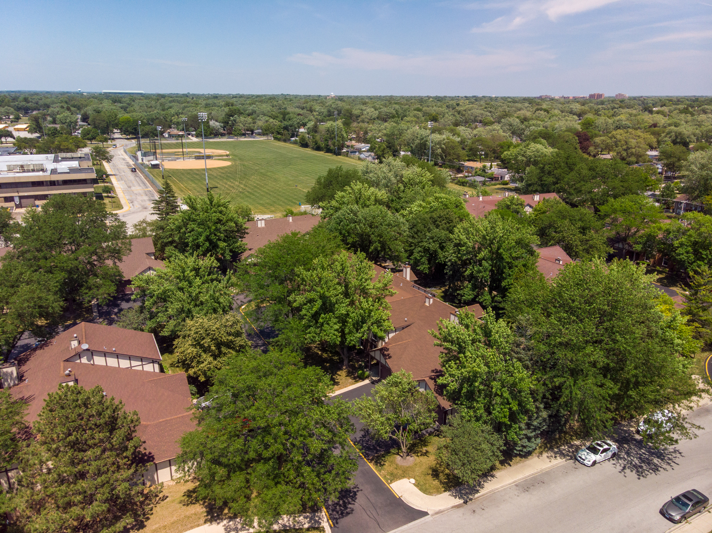 2710 Northampton Drive, Unit C2 Rolling Meadows, IL 60008 - Photo 18 of 19 an aerial view of residential houses with outdoor space and trees