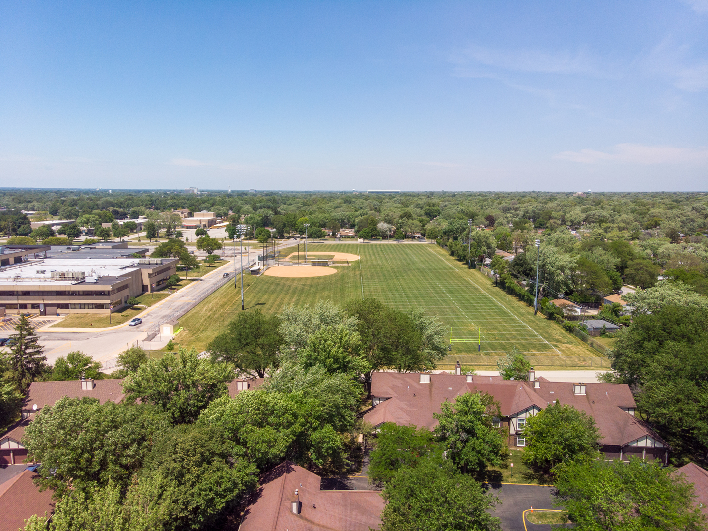 2710 Northampton Drive, Unit C2 Rolling Meadows, IL 60008 - Photo 19 of 19 an aerial view of residential houses with outdoor space and trees