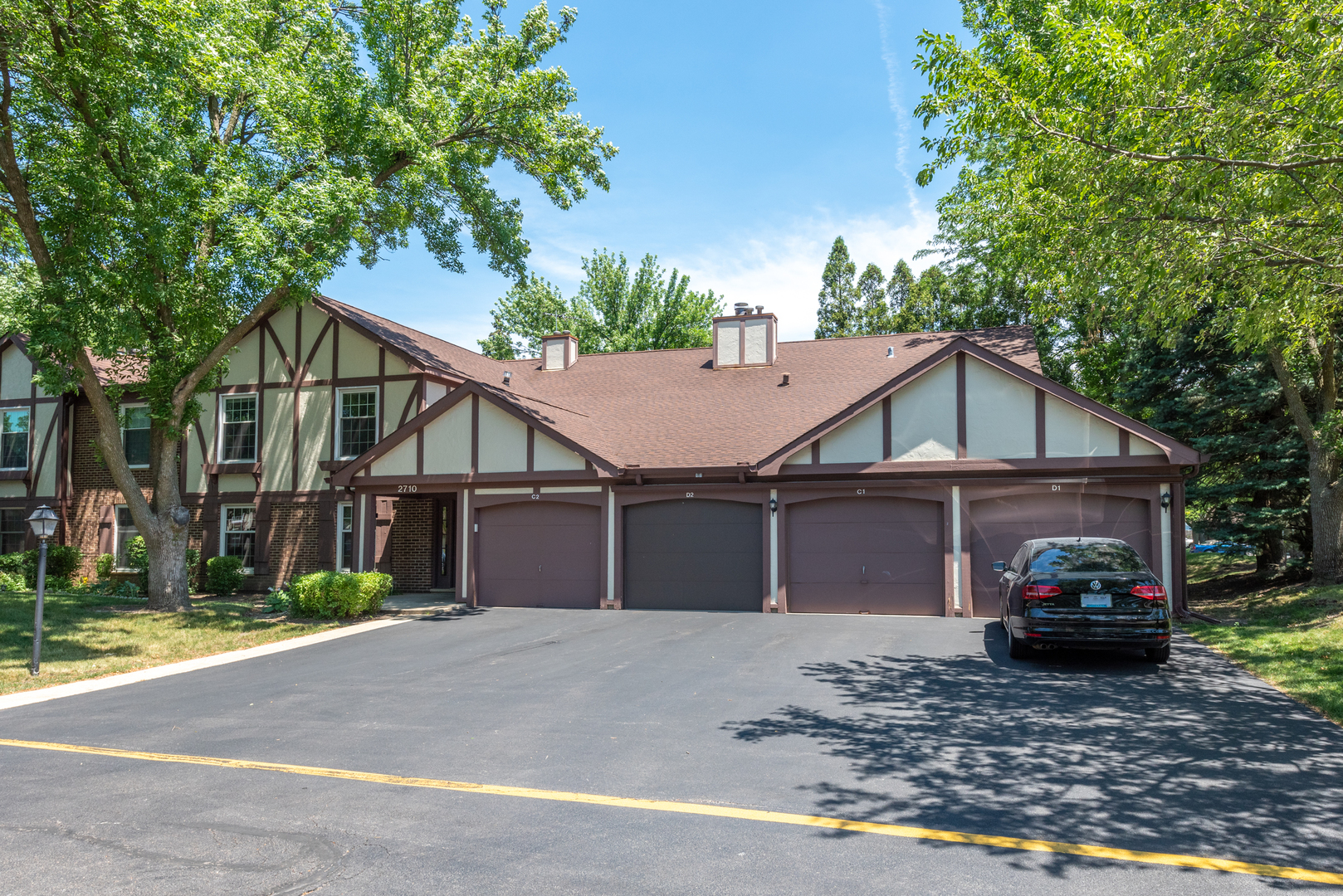 2710 Northampton Drive, Unit C2 Rolling Meadows, IL 60008 - Photo 2 of 19 a view of a car in front of a house
