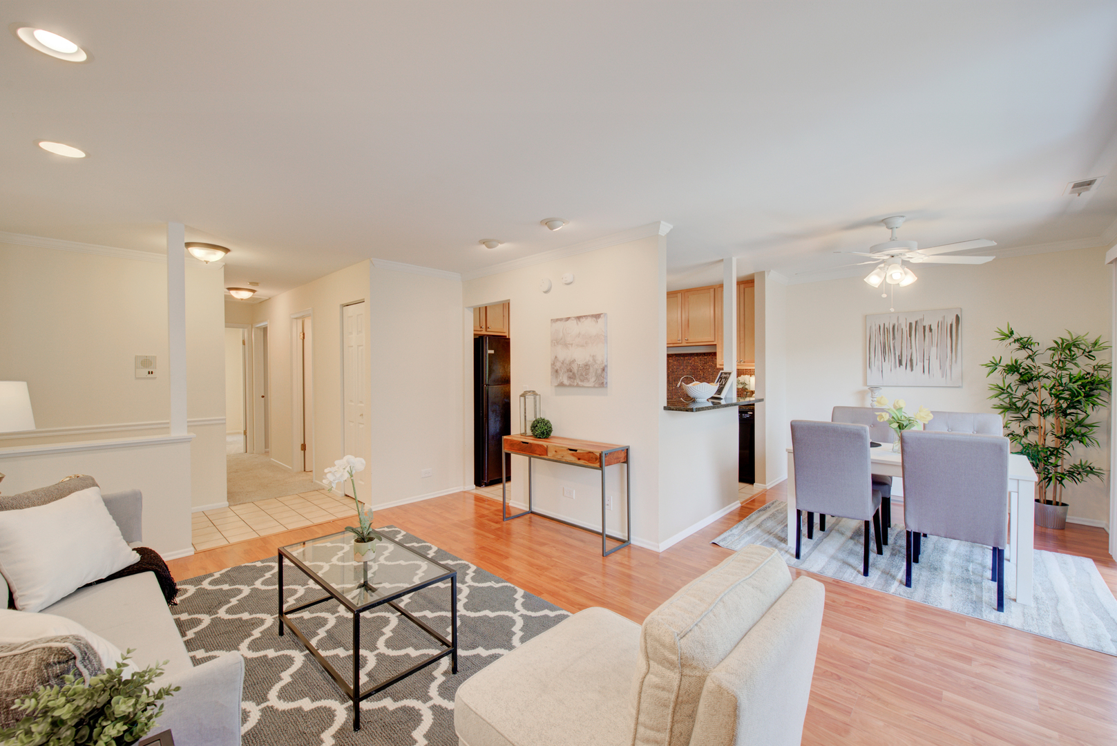 2710 Northampton Drive, Unit C2 Rolling Meadows, IL 60008 - Photo 5 of 19 a living room with furniture and kitchen view with wooden floor